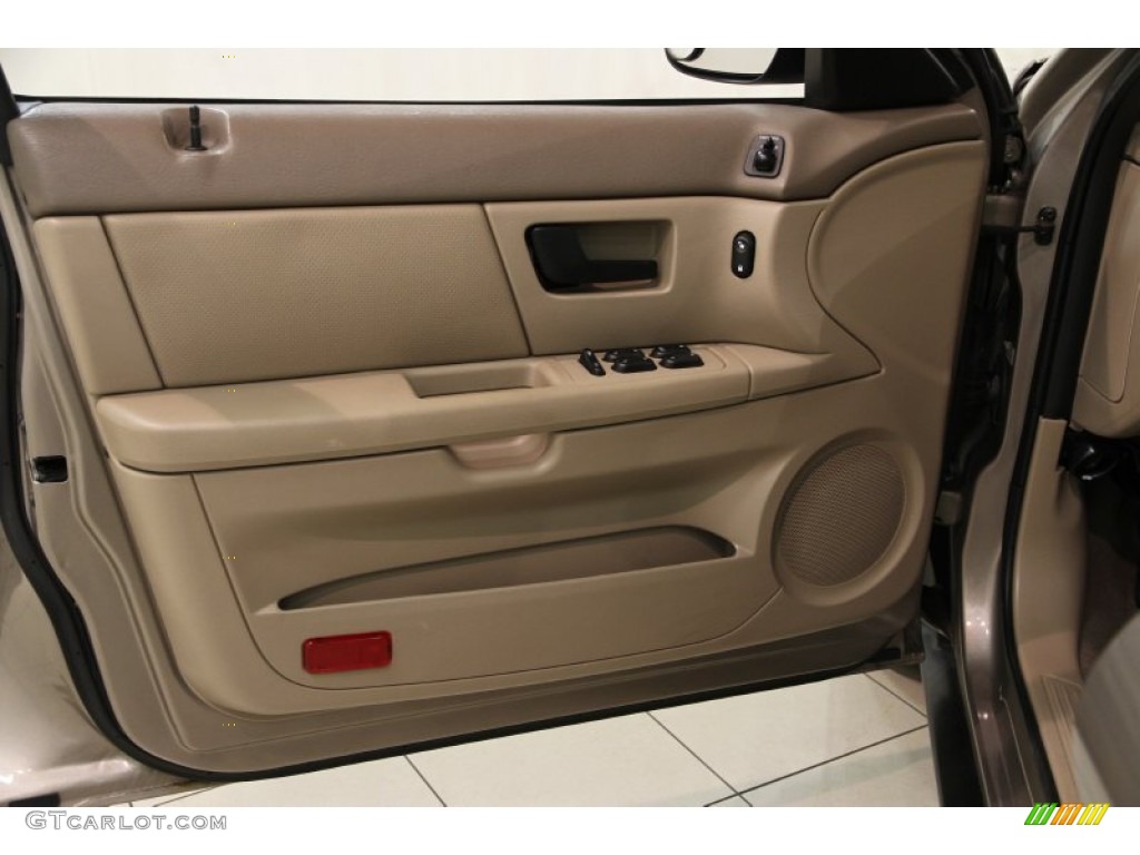 2005 Ford Taurus SE Medium/Dark Pebble Door Panel Photo #86101714