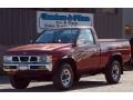 1995 Cherry Red Pearl Metallic Nissan Hardbody Truck XE Regular Cab 4x4 #86158463