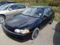Black 2000 Mitsubishi Mirage DE Sedan