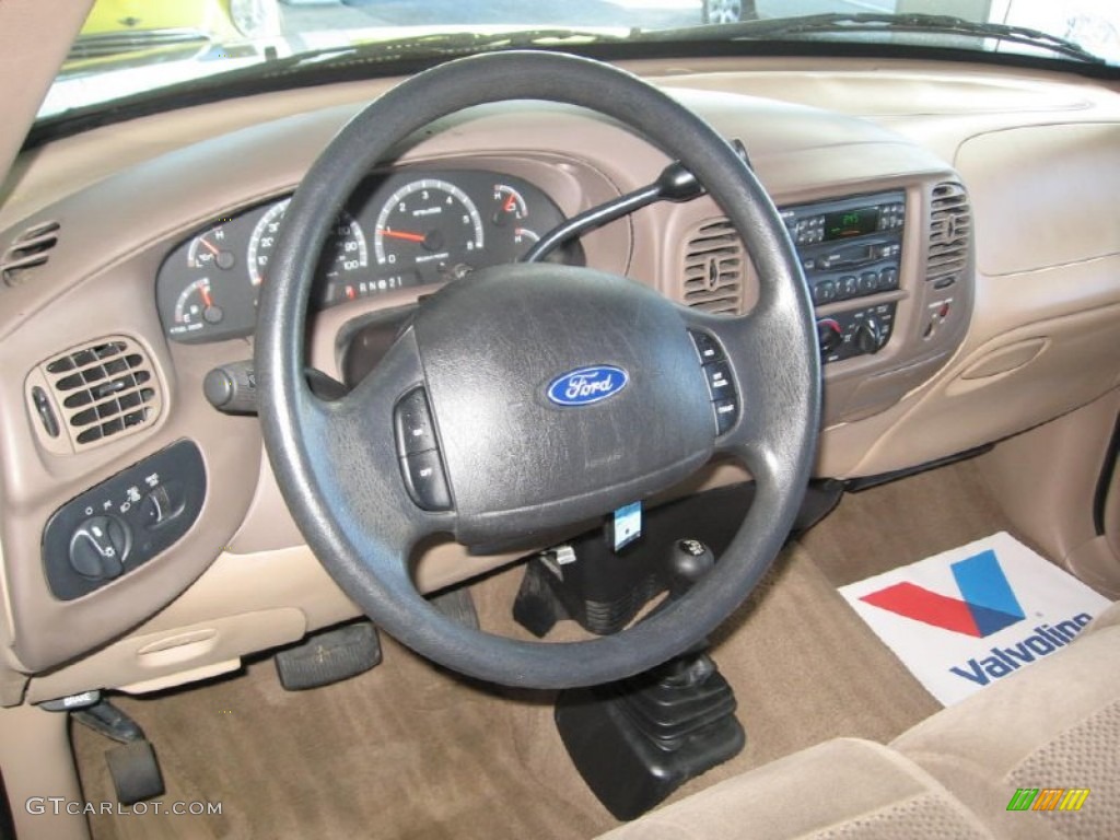 1999 Ford F150 Lariat Extended Cab 4x4 Medium Prairie Tan Steering Wheel Photo #86684931