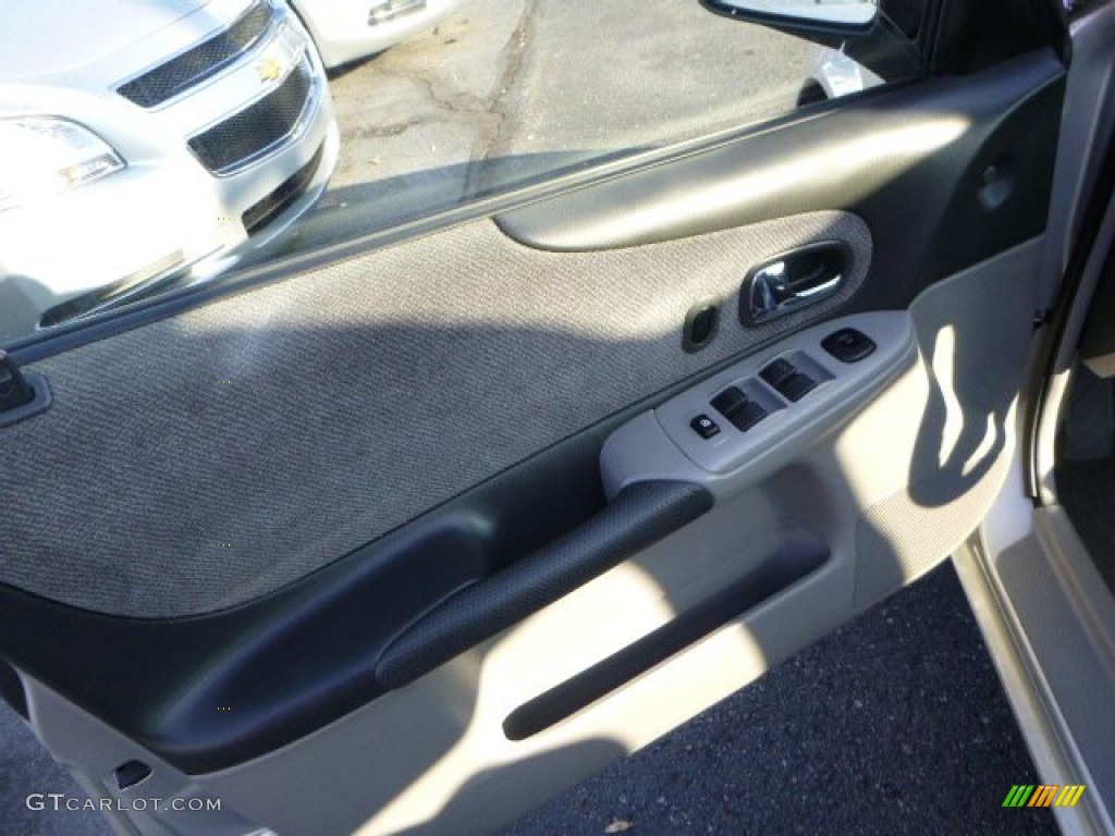 2002 Protege LX - Sunlight Silver Metallic / Off Black photo #11