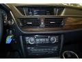 2014 BMW X1 Black Interior Controls Photo
