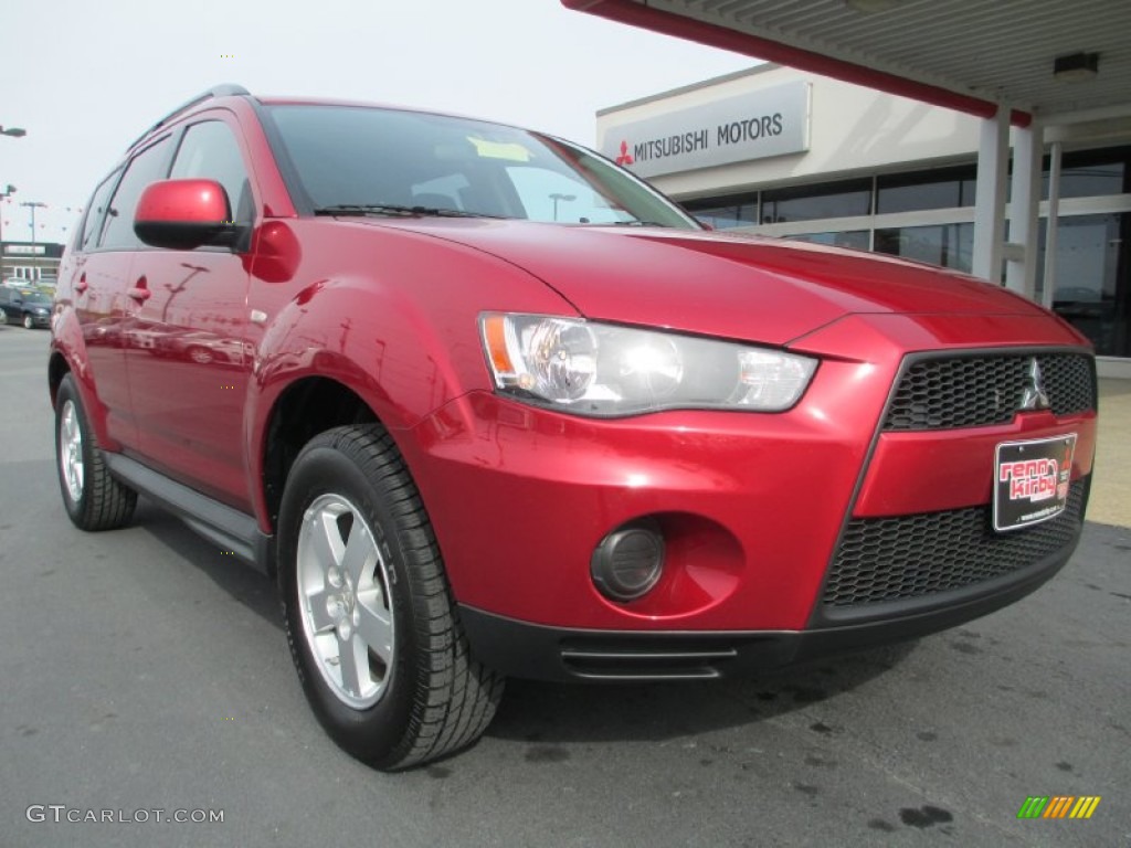 2010 Outlander ES 4WD - Rally Red Metallic / Black photo #1