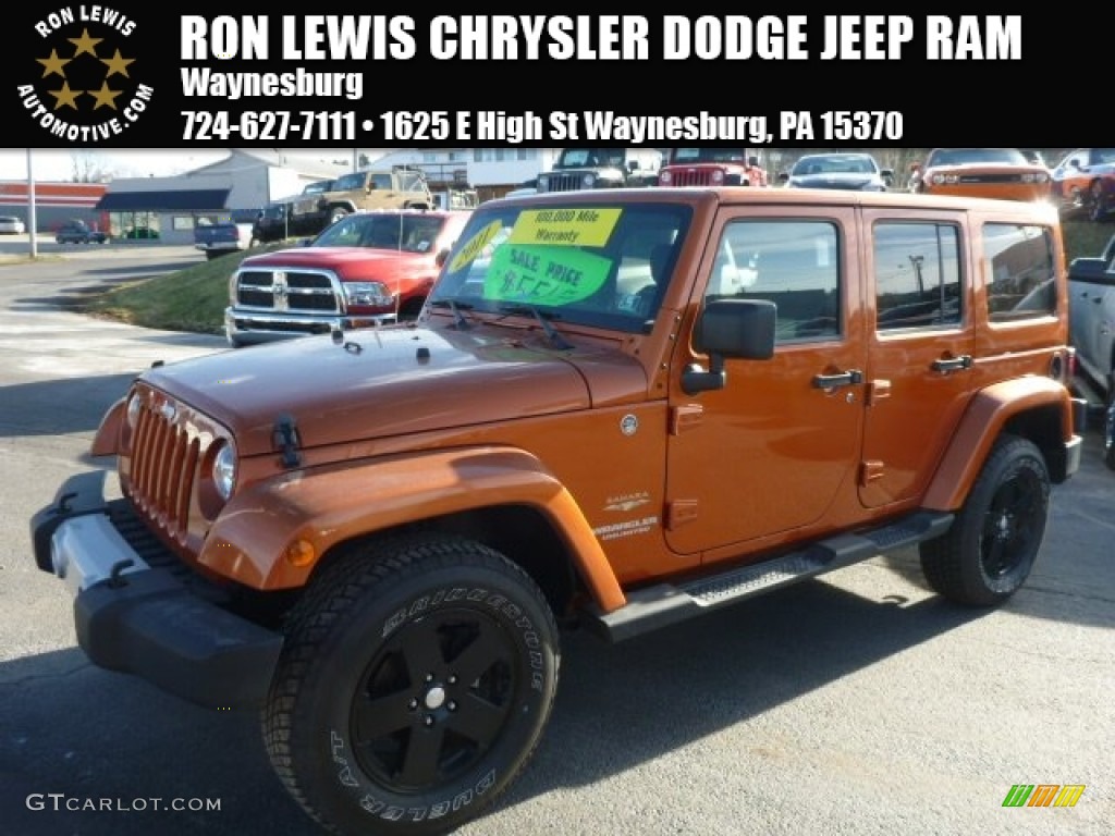 2011 Wrangler Unlimited Sahara 4x4 - Mango Tango Pearl / Black photo #1