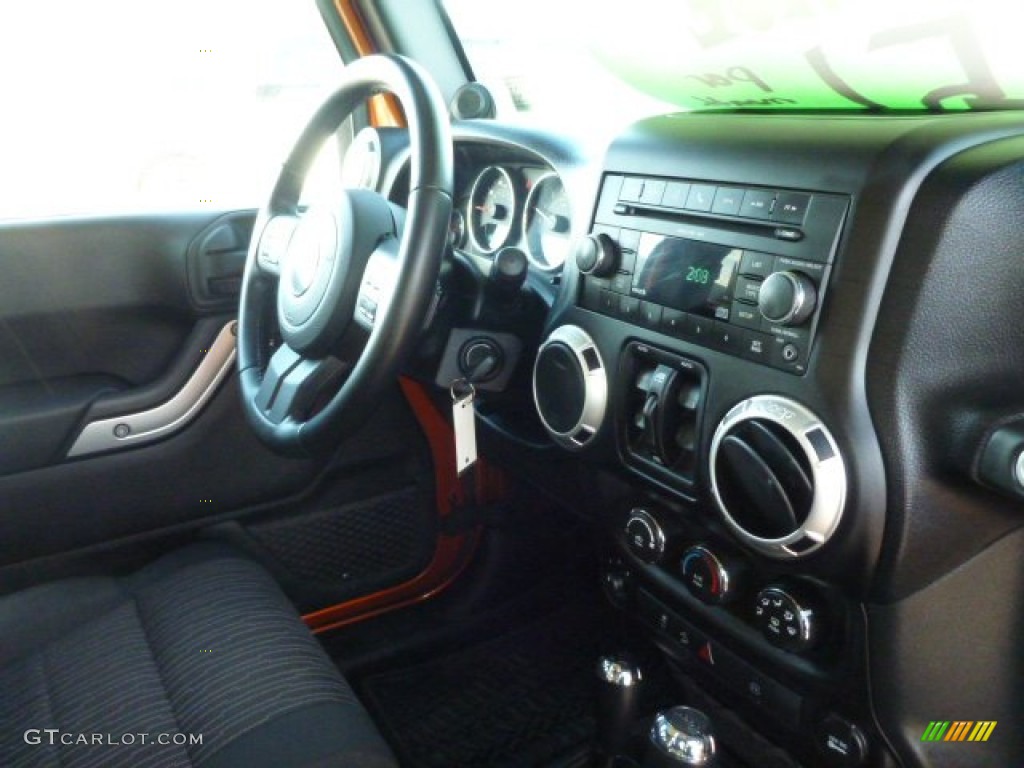 2011 Wrangler Unlimited Sahara 4x4 - Mango Tango Pearl / Black photo #7