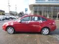 2010 Sangria Red Metallic Ford Focus SEL Sedan  photo #2