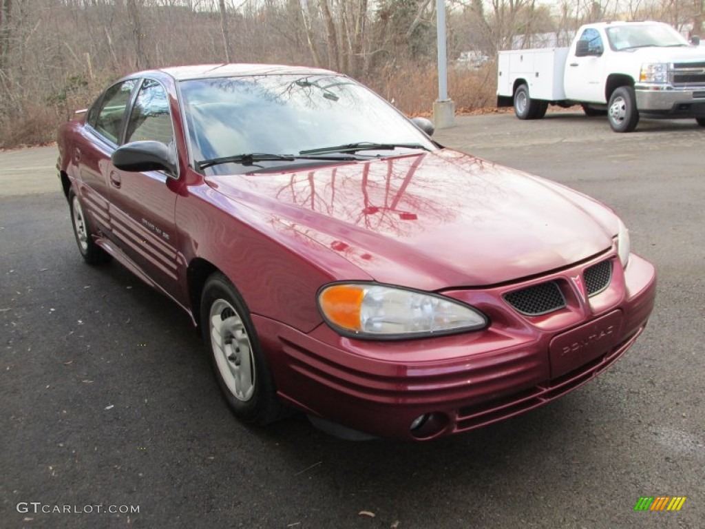2002 Grand Am SE Sedan - Redfire Metallic / Dark Taupe photo #7