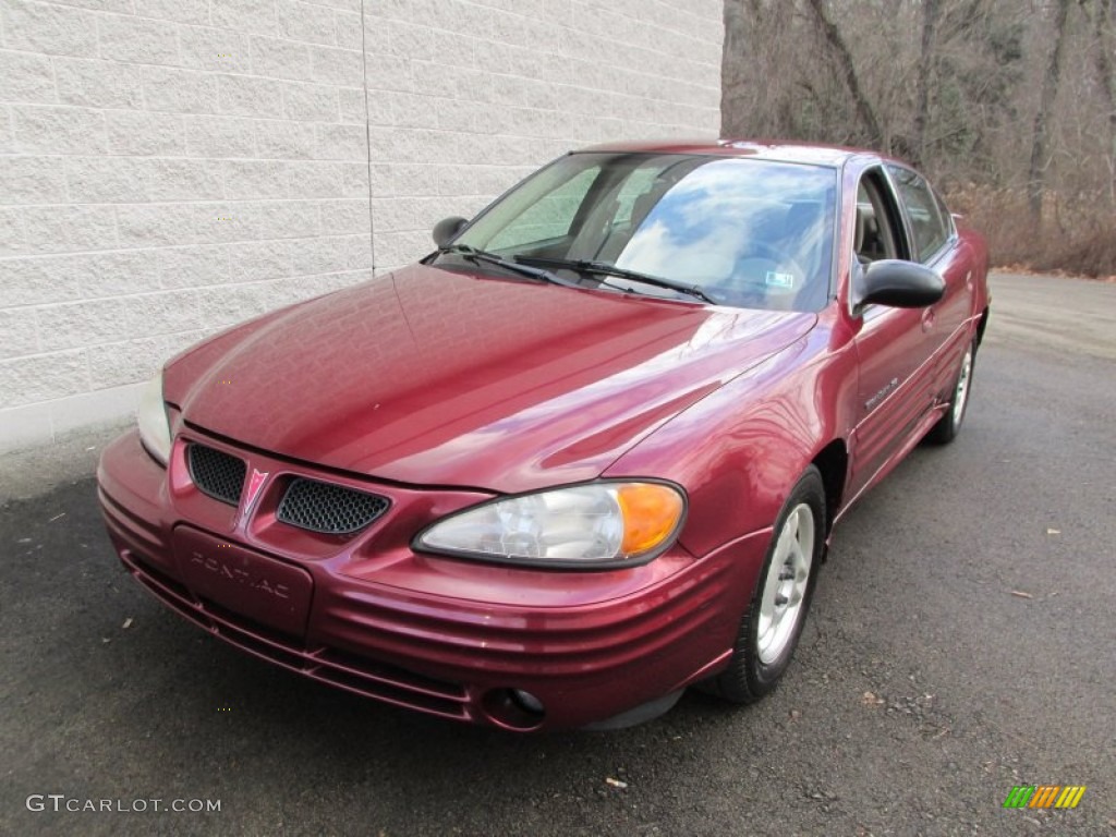 2002 Grand Am SE Sedan - Redfire Metallic / Dark Taupe photo #9