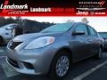 2014 Magnetic Gray Nissan Versa 1.6 SV Sedan  photo #1