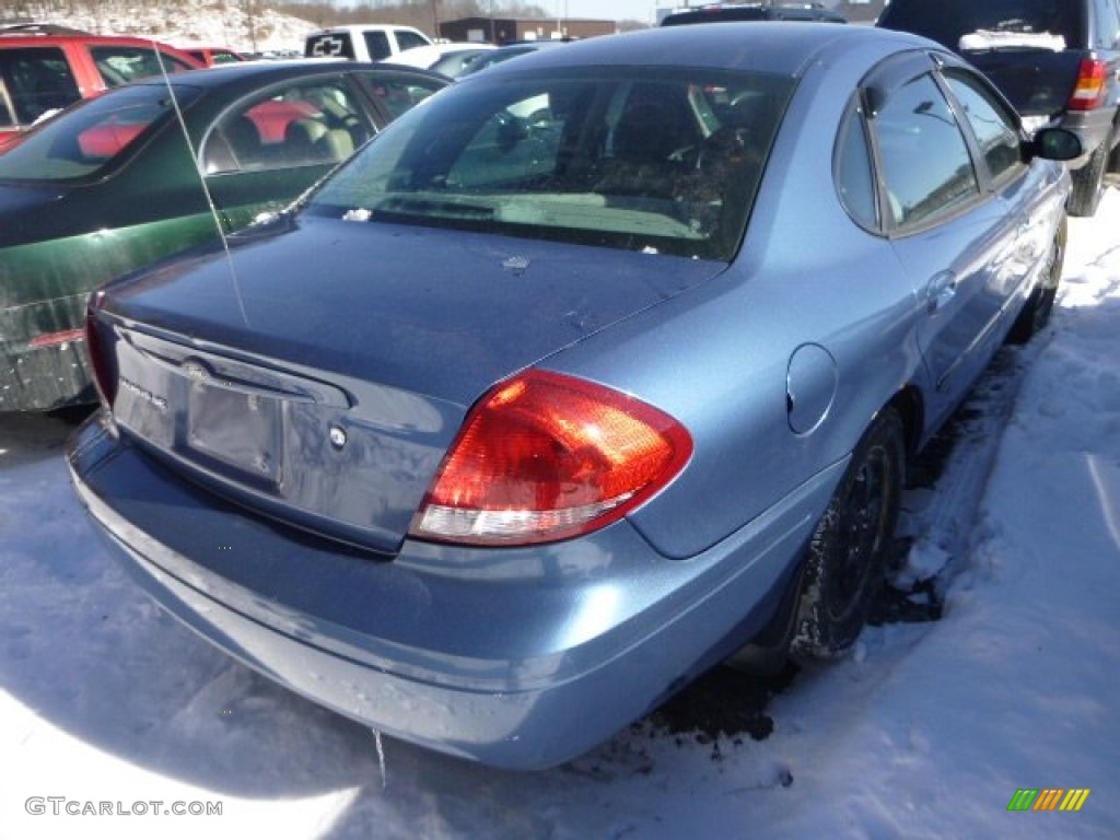 2004 Taurus SE Sedan - True Blue Metallic / Dark Charcoal photo #4