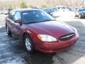 2002 Matador Red Metallic Ford Taurus SE  photo #1