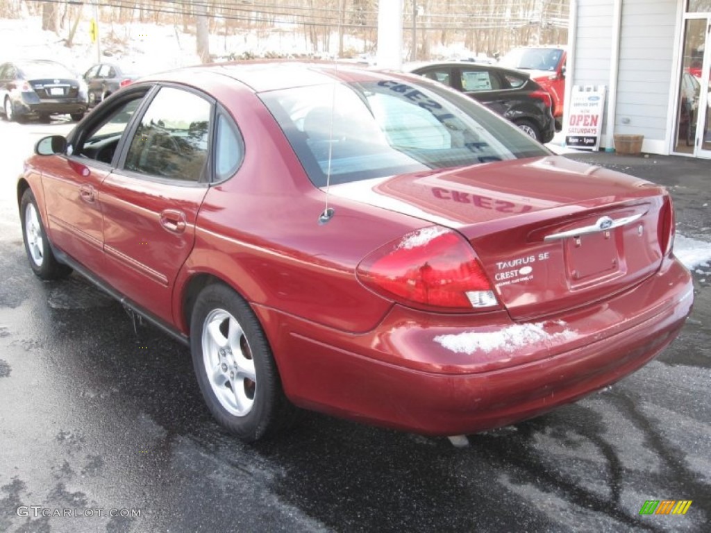 2002 Taurus SE - Matador Red Metallic / Dark Charcoal photo #5