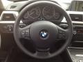 Black 2014 BMW 3 Series 320i xDrive Sedan Steering Wheel