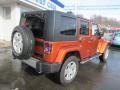 2010 Mango Tango Pearl Jeep Wrangler Unlimited Sahara 4x4  photo #9