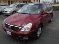 2014 Claret Red Kia Sedona LX  photo #1