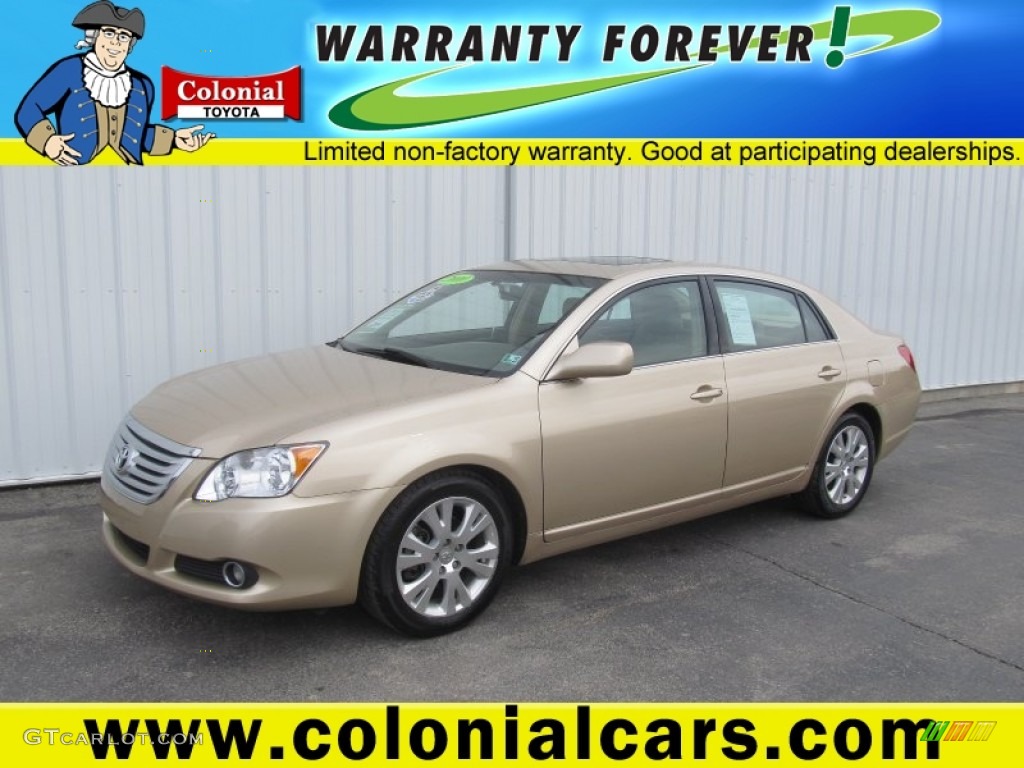 2010 Avalon XLS - Sandy Beach Metallic / Ivory photo #1