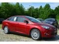 2014 Ruby Red Ford Focus Titanium Sedan  photo #1