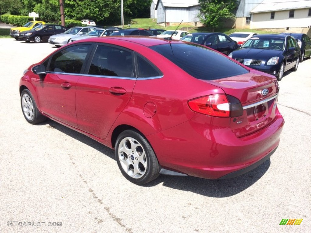 2011 Fiesta SEL Sedan - Bright Magenta Metallic / Plum/Charcoal Black Leather photo #17