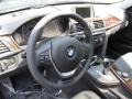 Black 2014 BMW 3 Series 320i xDrive Sedan Steering Wheel