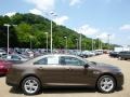  2015 Taurus SEL Caribou Metallic