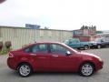 2011 Sangria Red Metallic Ford Focus SEL Sedan  photo #1