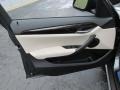 2015 BMW X1 Oyster/Orange-Black Piping Interior Door Panel Photo