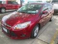 2014 Ruby Red Ford Focus SE Sedan  photo #1