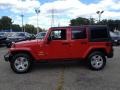 2011 Flame Red Jeep Wrangler Unlimited Sahara 4x4  photo #12