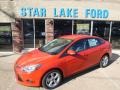 2014 Race Red Ford Focus SE Sedan  photo #1