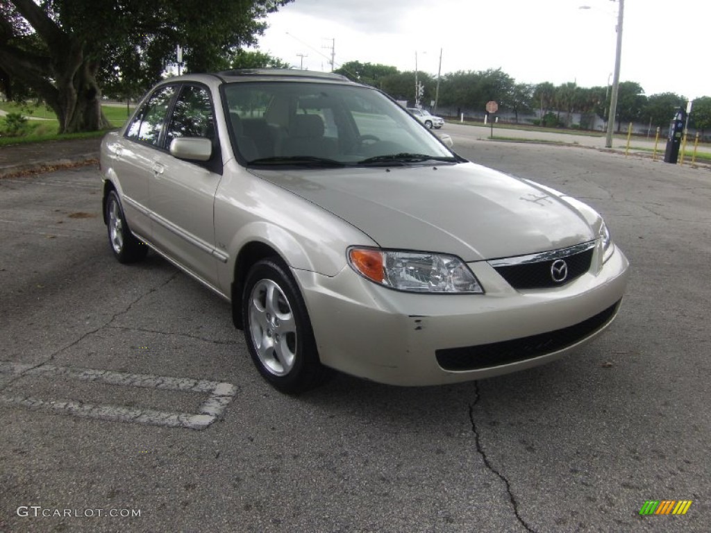 2002 Protege LX - Light Sandalwood Metallic / Beige photo #6