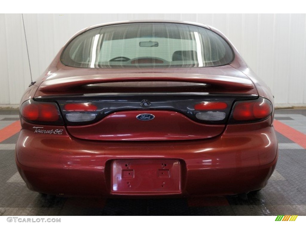 1999 Taurus SE - Toreador Red Metallic / Medium Graphite photo #9