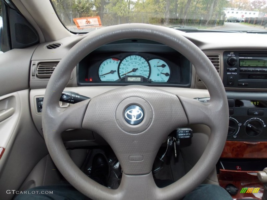 2004 Toyota Corolla LE Pebble Beige Steering Wheel Photo #99164925